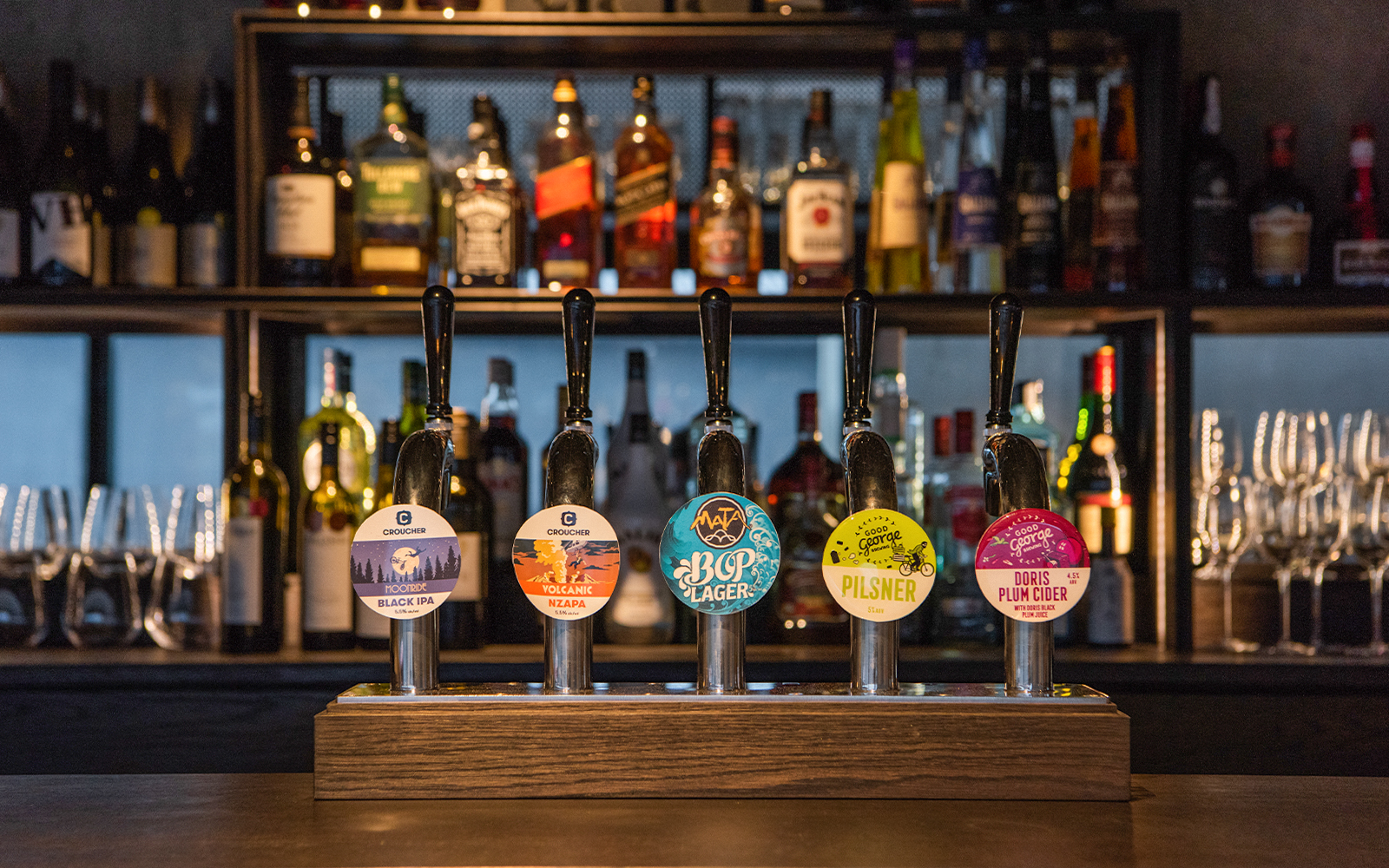Bar with various beer taps at Te Puia's Hāngī Buffet Dinner in Rotorua, New Zealand.