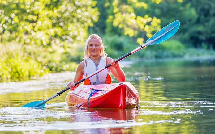 Kayaking on clear waters in Blue Eye, Albania.
