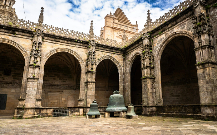 Cloister arcade with bells at Santiago de Compostela Cathedral, Galicia, Spain.