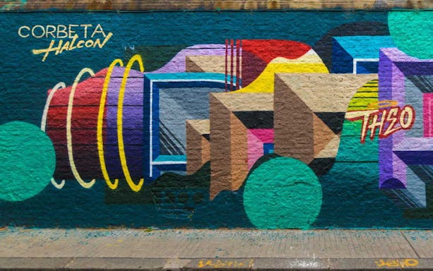 Colorful geometric graffiti on a wall in Buenos Aires during a city tour.