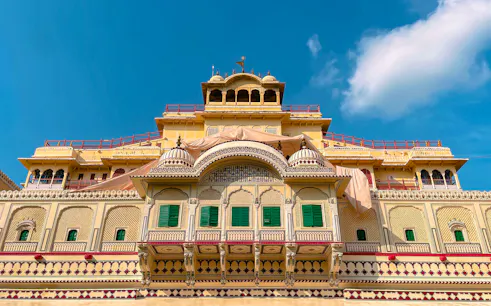 Facade of Jaipur's City Palace with ornate architecture, part of the Golden Triangle India Tour.