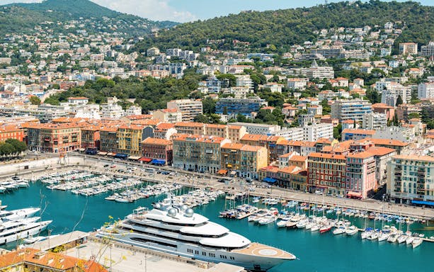 Harbor view in Nice, France with colorful buildings and yachts, part of Provence in One Day tour.
