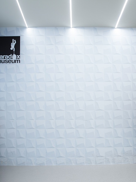 Visitors in an optical illusion room at Paradox Museum, Stockholm.