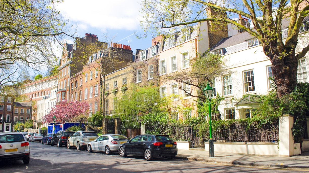 Kensington Square London with historic architecture and lush greenery.