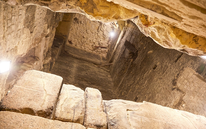 Inside view of the Step Pyramid of Djoser, showcasing ancient stone walls, Saqqara, Egypt.