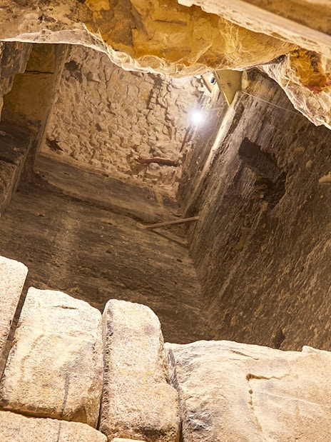 Inside view of the Step Pyramid of Djoser, showcasing ancient stone walls, Saqqara, Egypt.