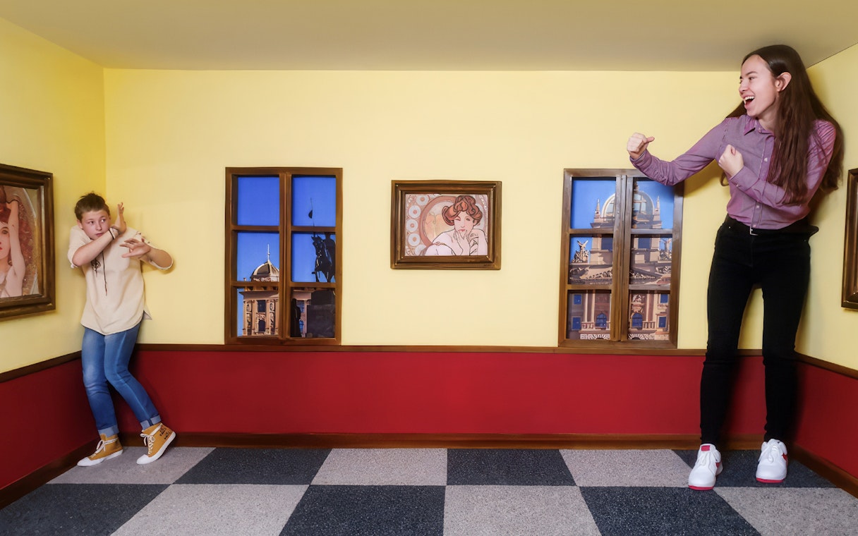 Visitors in an optical illusion room at the Museum of Fantastic Illusions.