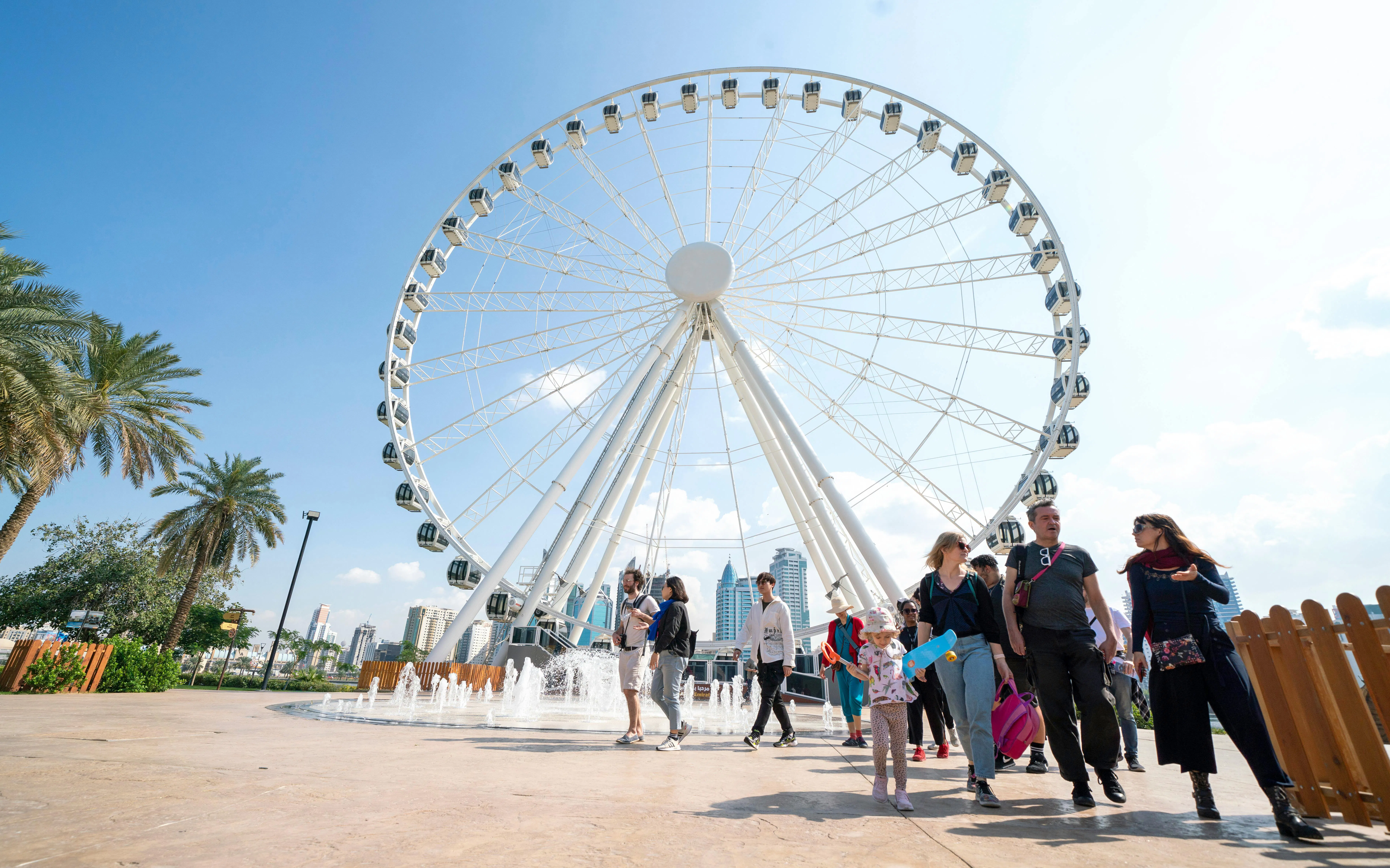 Ferris wheel and visitors at Al Montazah Parks, Island of Legends.