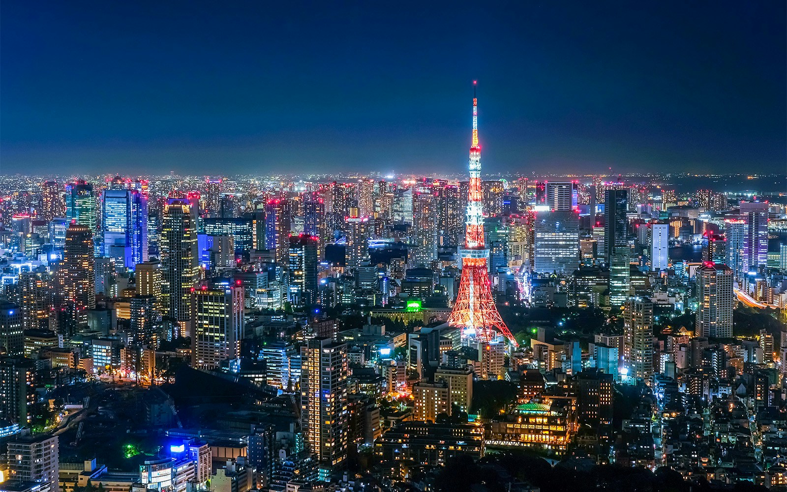 Tokyo skyline at night with Tokyo Tower viewed from Roppongi Hills Observation Deck.