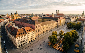 Aerial view of Munich cityscape featuring historic buildings and Marienplatz, part of the Oktoberfest Origins Walking Tour.