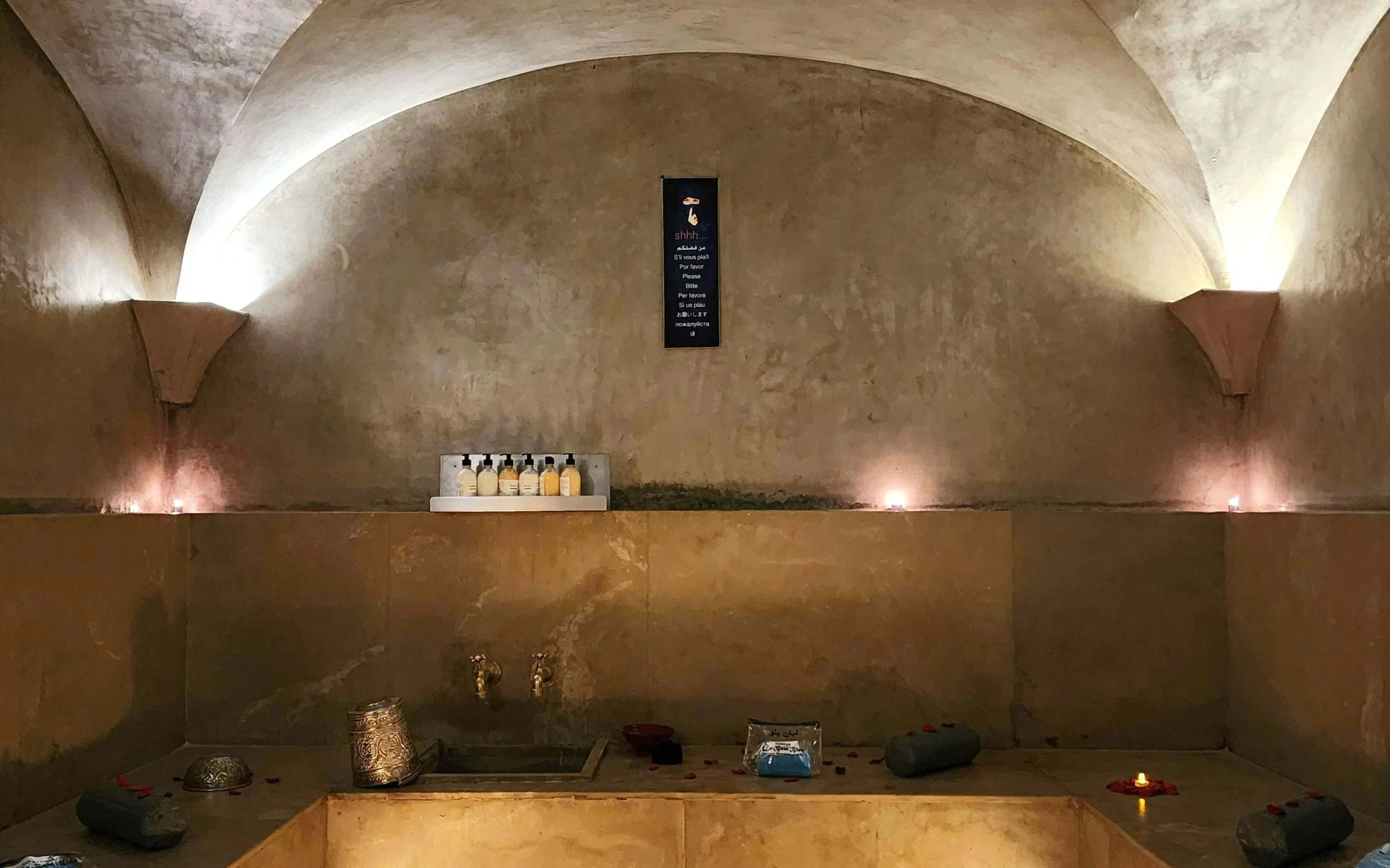 Le Bain Bleu Hammam & Spa interior with candles and bath products, Marrakesh.