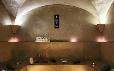Le Bain Bleu Hammam & Spa interior with candles and bath products, Marrakesh.