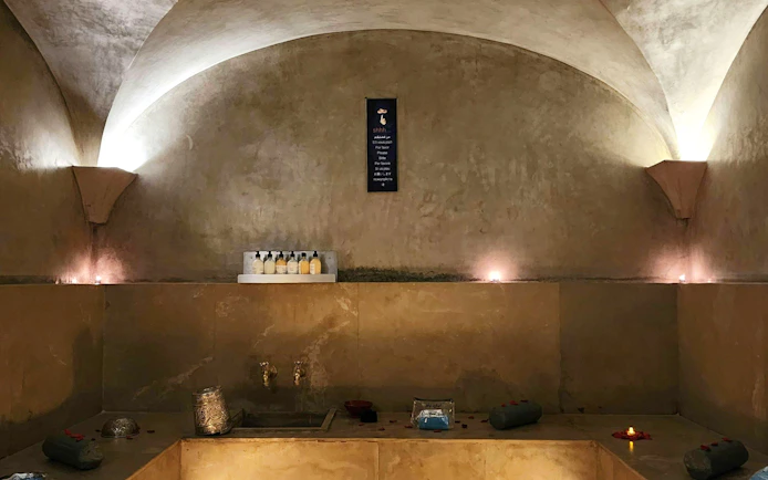 Le Bain Bleu Hammam & Spa interior with candles and bath products, Marrakesh.