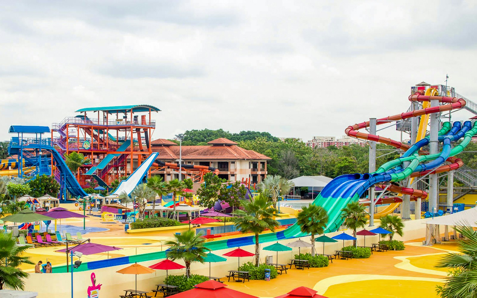Water slides and colorful attractions at Wild Wild Wet water park in Singapore.