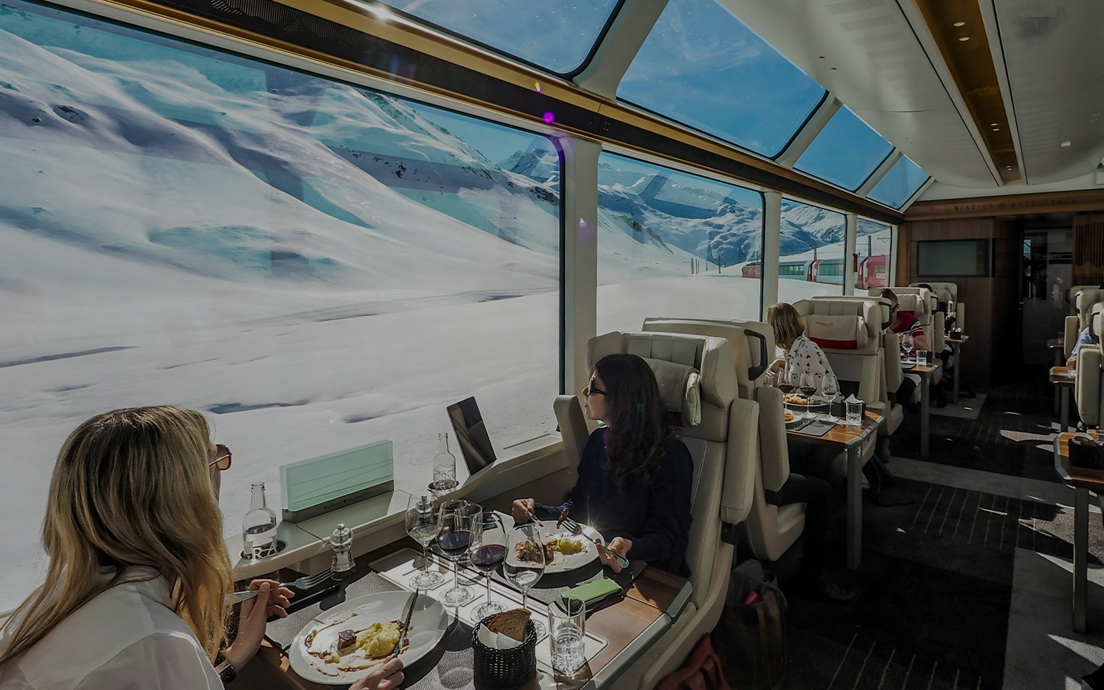 women enjoying view and glacier express food