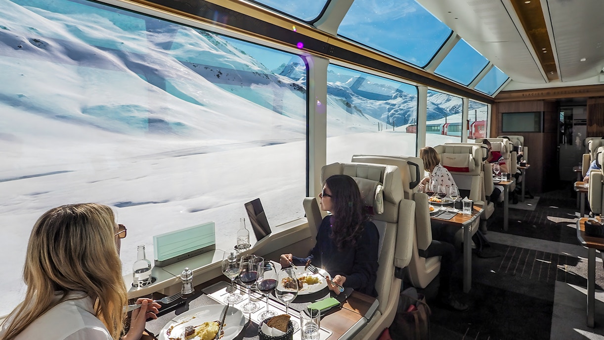 women enjoying view and glacier express food