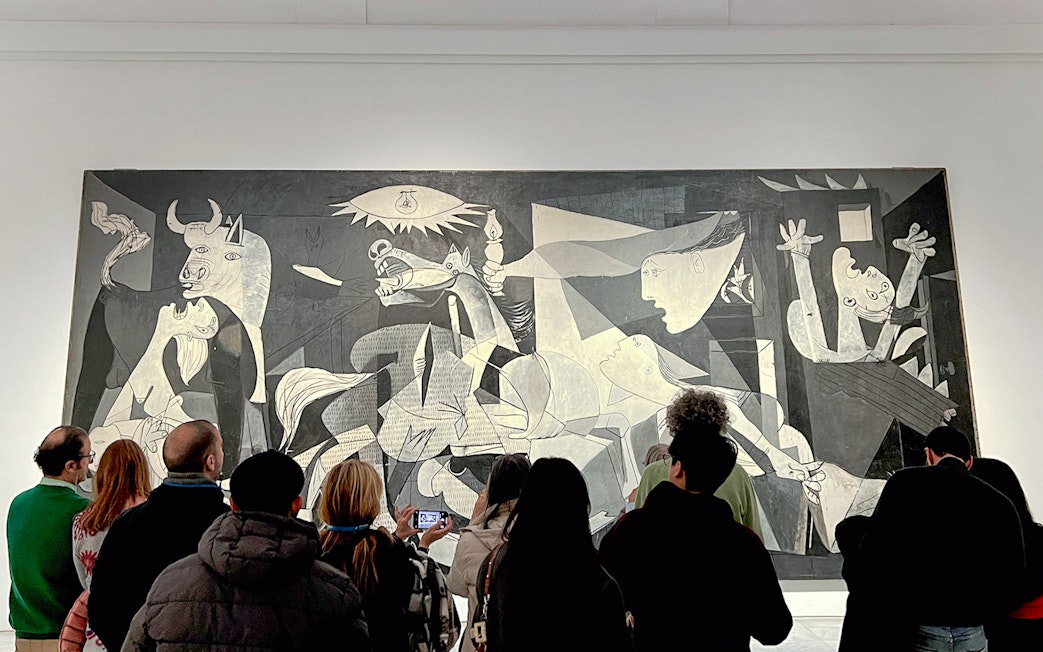 Visitors viewing Picasso's Guernica, 1937, at Reina Sofia Museum, Madrid.