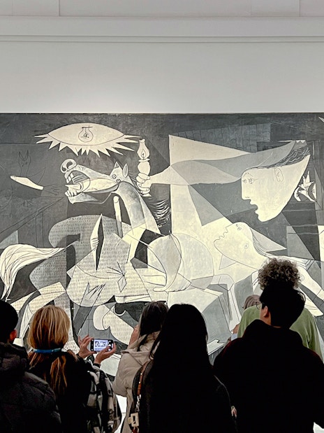 Visitors viewing Picasso's Guernica, 1937, at Reina Sofia Museum, Madrid.