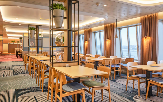 Buffet dining area on ferry from Tallinn to Helsinki with large windows and modern decor.