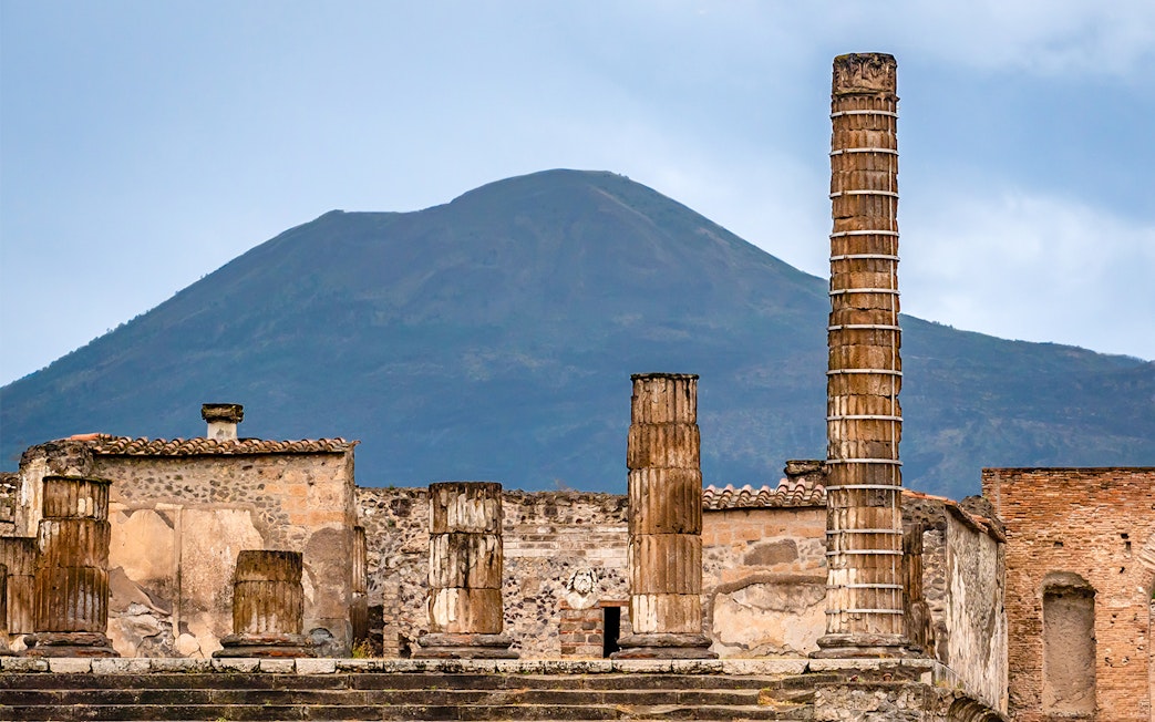 Ancient ruins of Pompeii with Mount Vesuvius in the background, Naples, Italy.