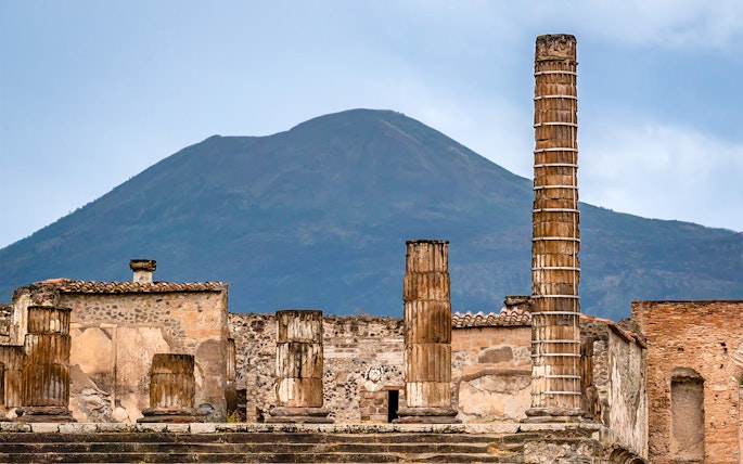 Ancient ruins of Pompeii with Mount Vesuvius in the background, Naples, Italy.