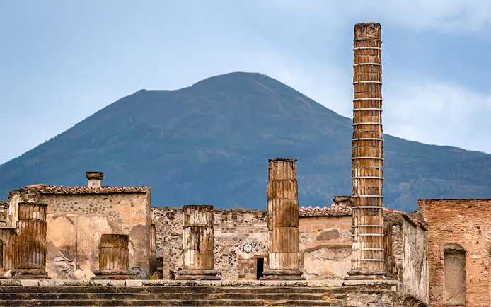 Ancient ruins of Pompeii with Mount Vesuvius in the background, Naples, Italy.