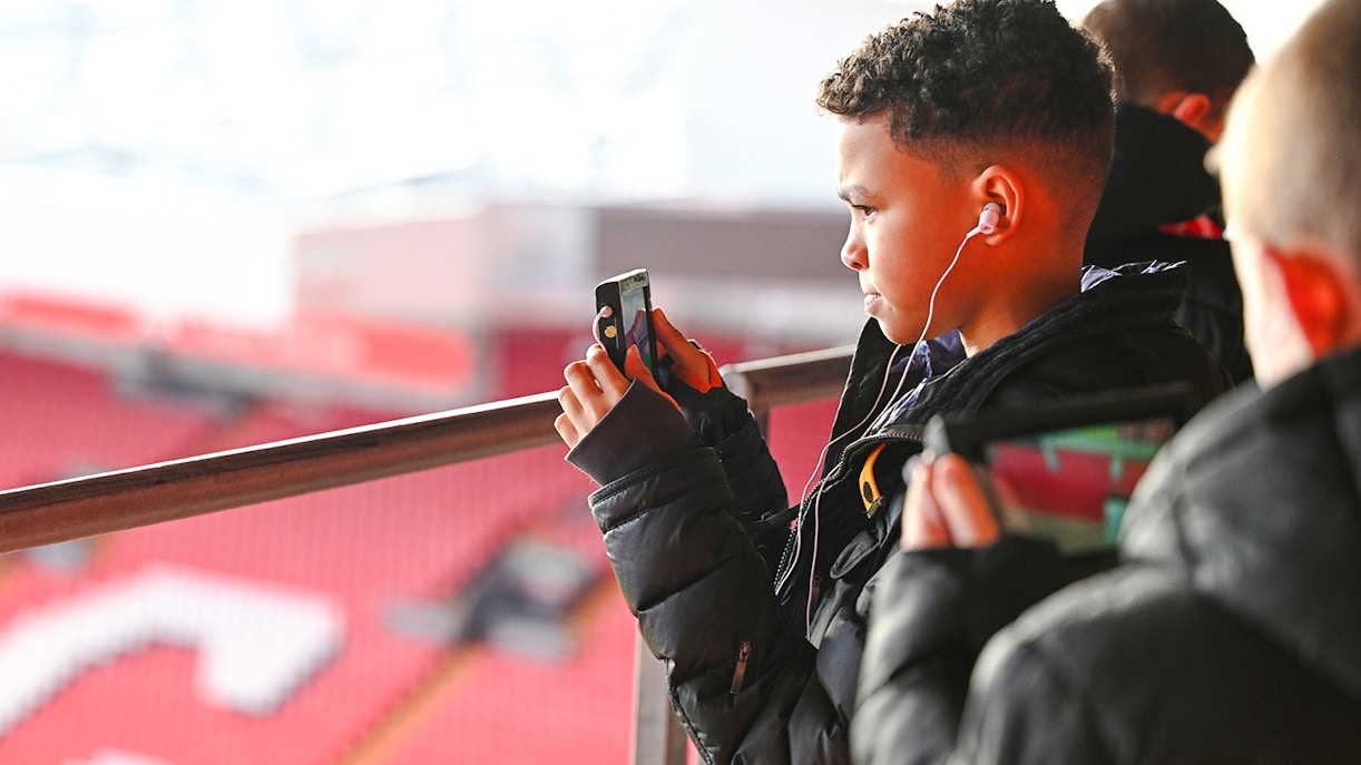 Guests taking photos at Anfield Stadium, Liverpool.