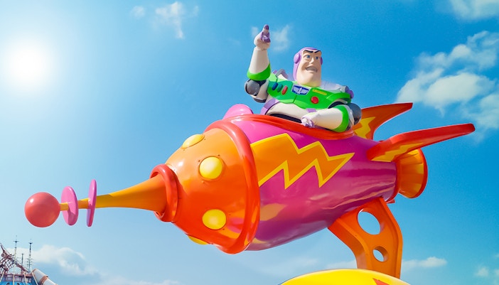 Buzz Lightyear on colorful rocket at Disneyland Paris Park.