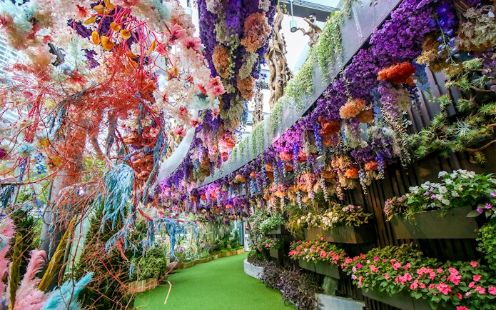 Floral Fantasy display with vibrant hanging flowers at Gardens by the Bay, Singapore.