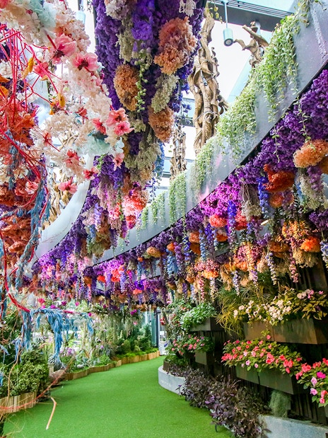 Floral Fantasy display with vibrant hanging flowers at Gardens by the Bay, Singapore.