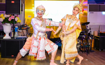 Traditional dancers performing on the Smile Riverside Dinner Cruise with international buffet.