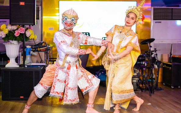 Traditional dancers performing on the Smile Riverside Dinner Cruise with international buffet.