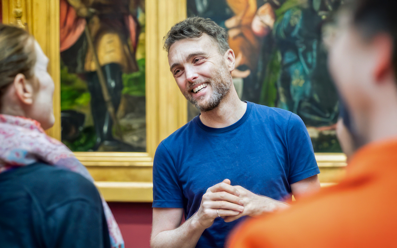 A guide giving a tour of a hitroy musuem in Vienna