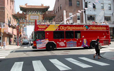 Philadelphia sightseeing bus near Chinatown Friendship Gate on Hop-On-Hop-Off Tour.