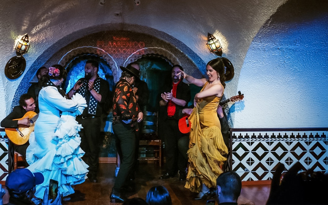 Flamenco dancers performing at Tablao Cordobes in a vibrant show.