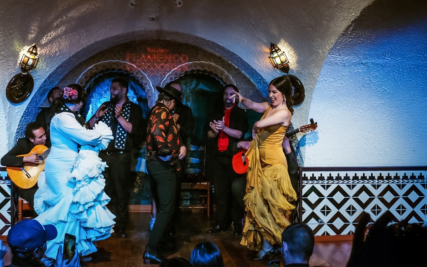 Flamenco dancers performing at Tablao Cordobes in a vibrant show.