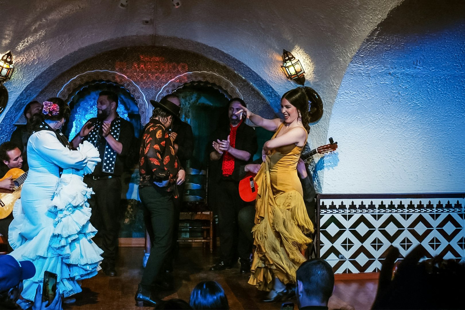 Flamenco dancers performing at Tablao Cordobes in a vibrant show.