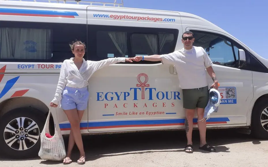 Private transfer van at Marsa Alam Airport for Soma Bay Hotel with passengers.
