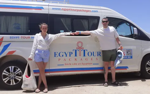 Private transfer van at Marsa Alam Airport for Soma Bay Hotel with passengers.