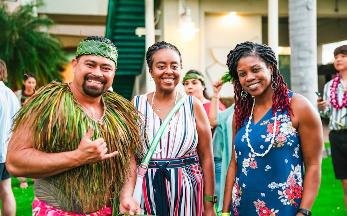 Guests enjoying a traditional Hawaiian luau at Moana Luau, Hawaii.