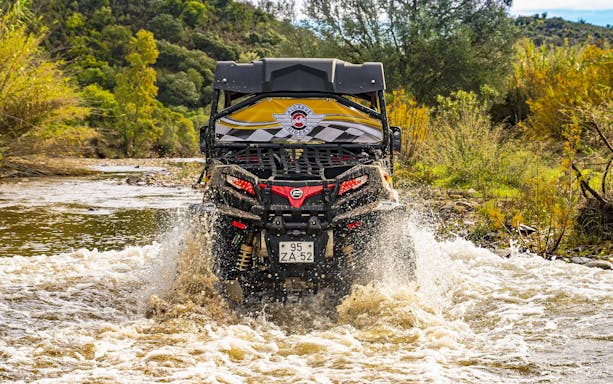 Buggy crossing a stream during a 2-hour off-road tour in Albufeira, Portugal.