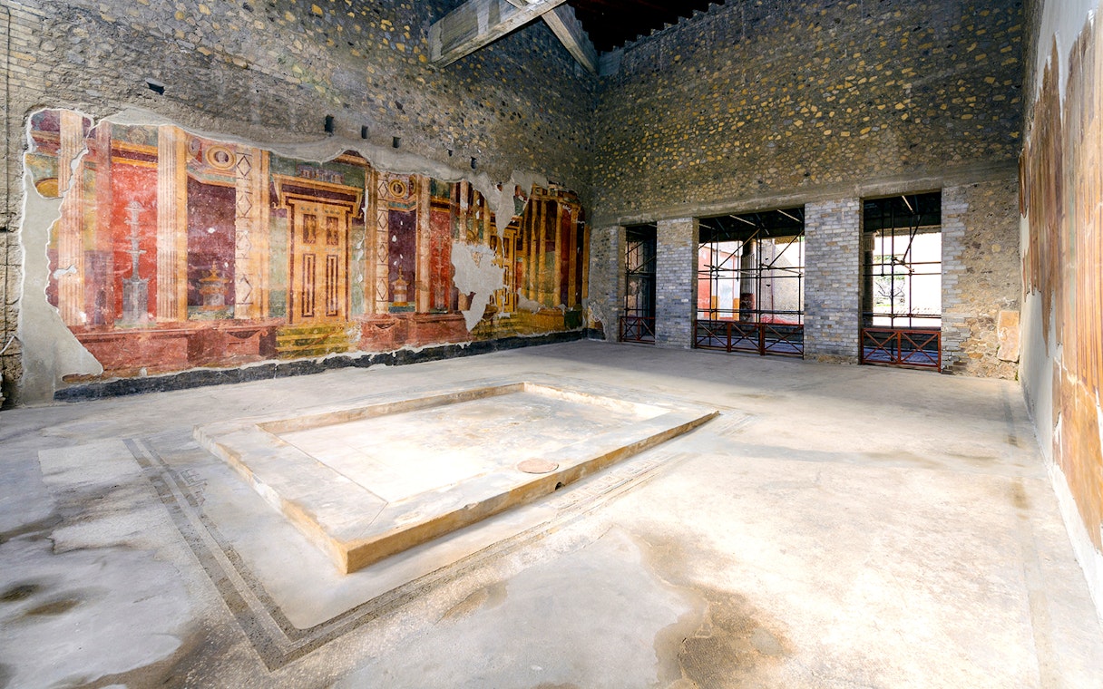 Ancient frescoes and ruins at Oplontis archaeological site, Italy, on a small group tour.