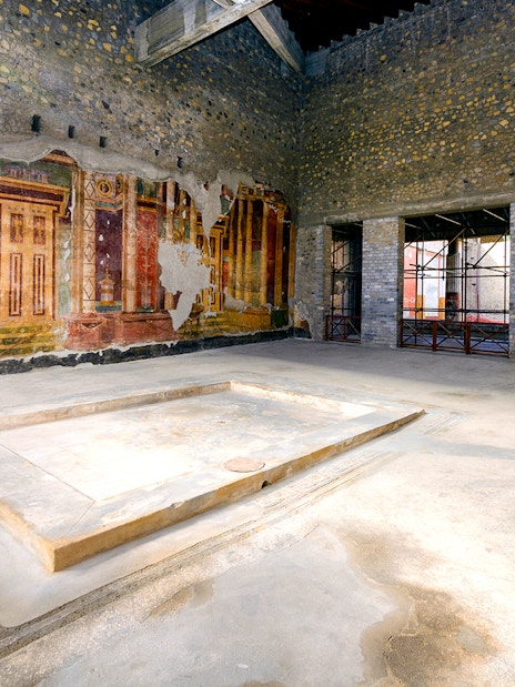 Ancient frescoes and ruins at Oplontis archaeological site, Italy, on a small group tour.
