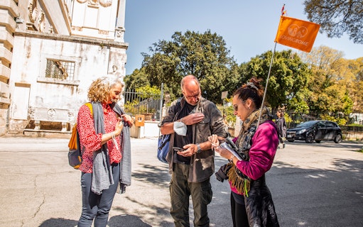Visitors preparing for a Borghese Gallery tour with a guide in Rome.