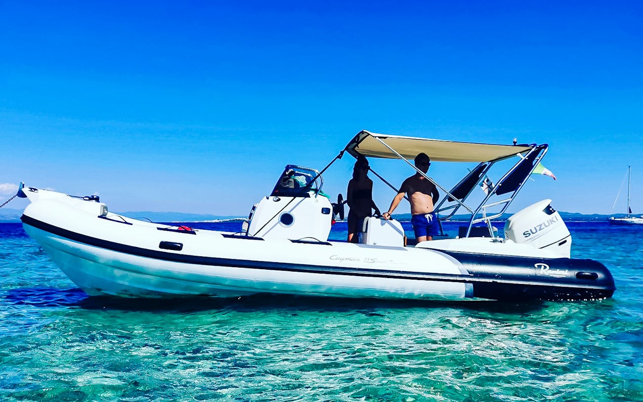 Sant'Antioco Island boat trip with skipper, showcasing coastal views and sightseeing cruise experience.