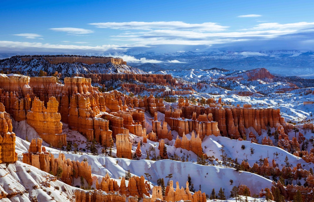 Grand Canyon covered in snow during winter, showcasing the canyon's vast landscape and unique seasonal beauty.