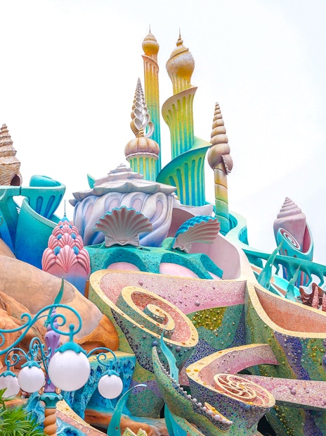 Colorful seashell-themed architecture at Tokyo Disneyland's Mermaid Lagoon.