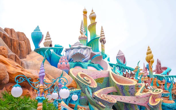 Colorful seashell-themed architecture at Tokyo Disneyland's Mermaid Lagoon.