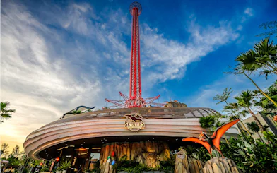 Wide angle view of SkyFlyer ride at Asiatique Bangkok with clear sky backdrop.