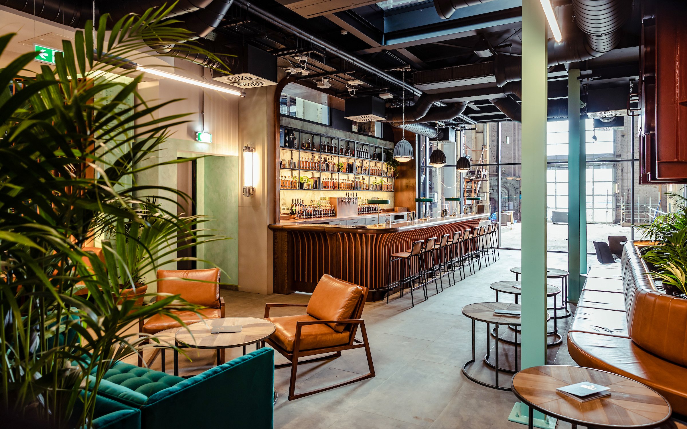 Roe & Co Distillery bar area with seating and modern decor.